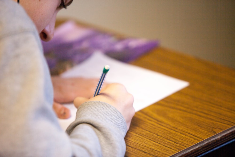 Student making notes during APSC preparation