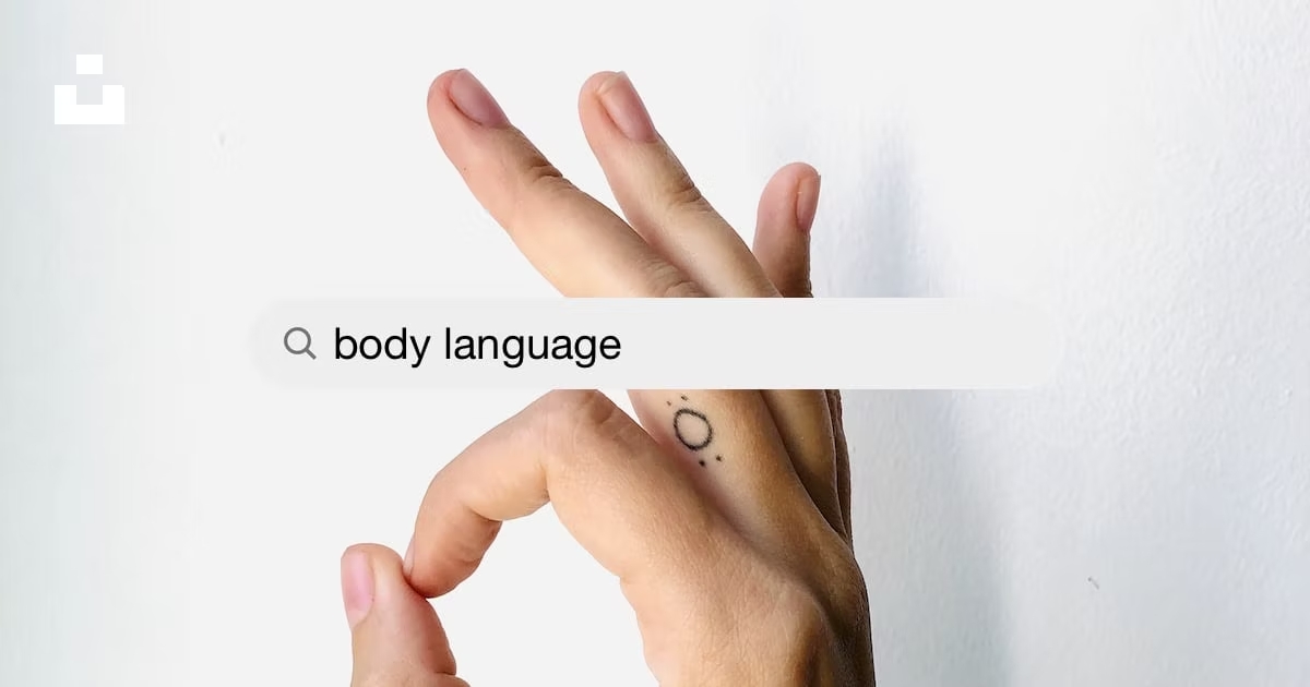 Body language. Image shows hand gesture